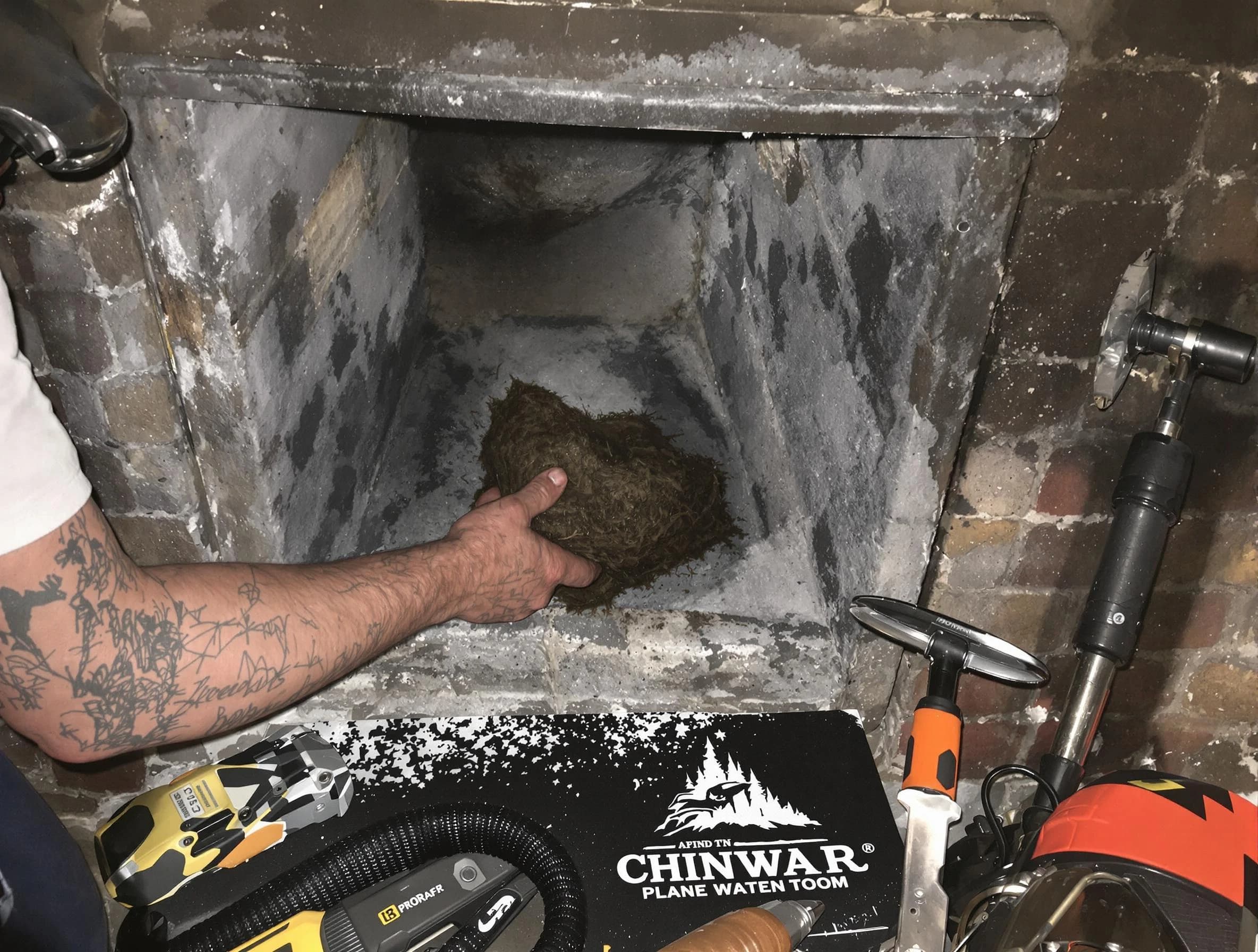 Kirtland AFB Chimney Sweep safely removing debris and screening chimney in Kirtland AFB, NM